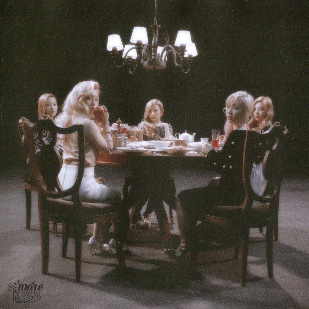 girl group red velvet sitting around a table